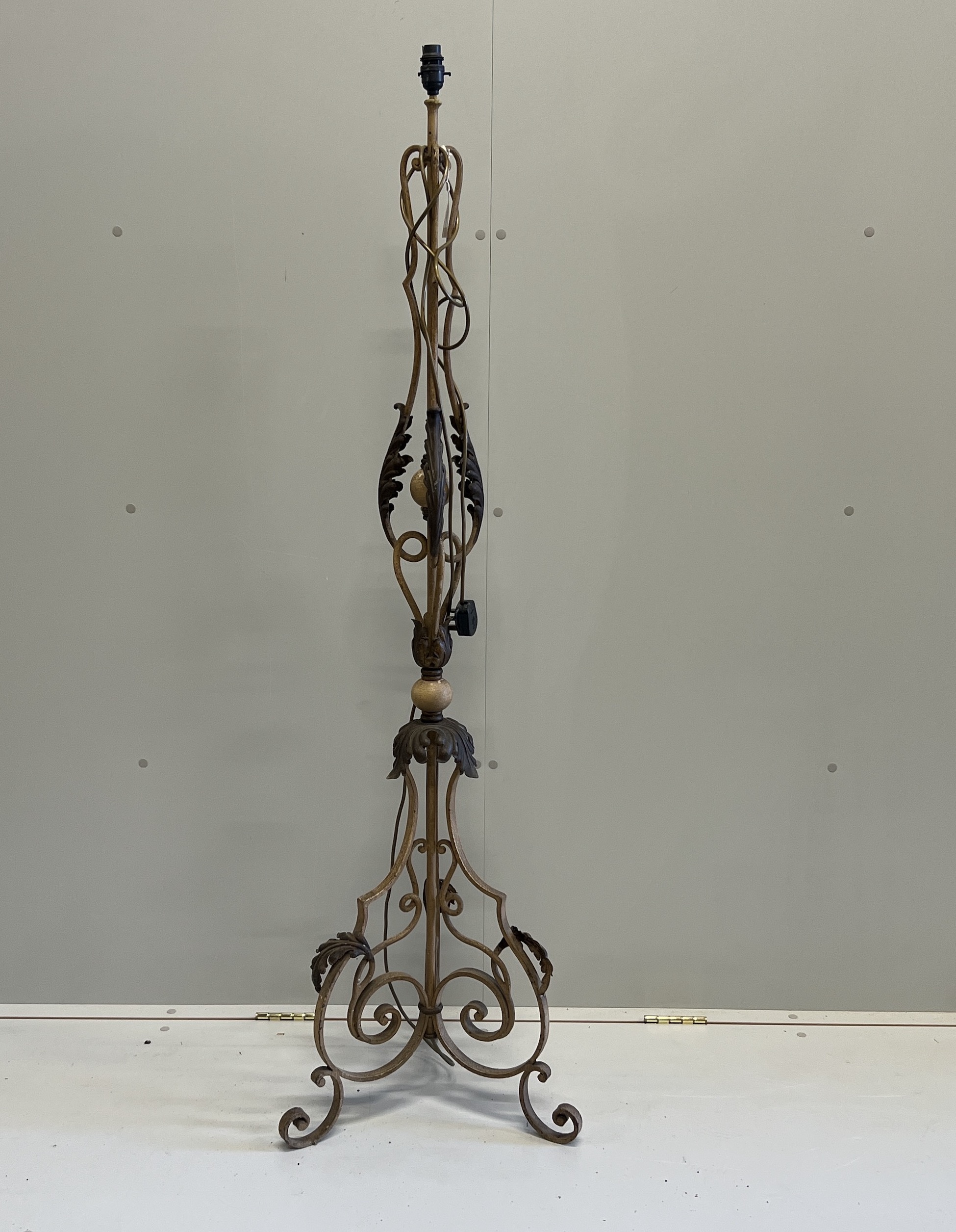An early 20th century French wrought iron telescopic standard lamp